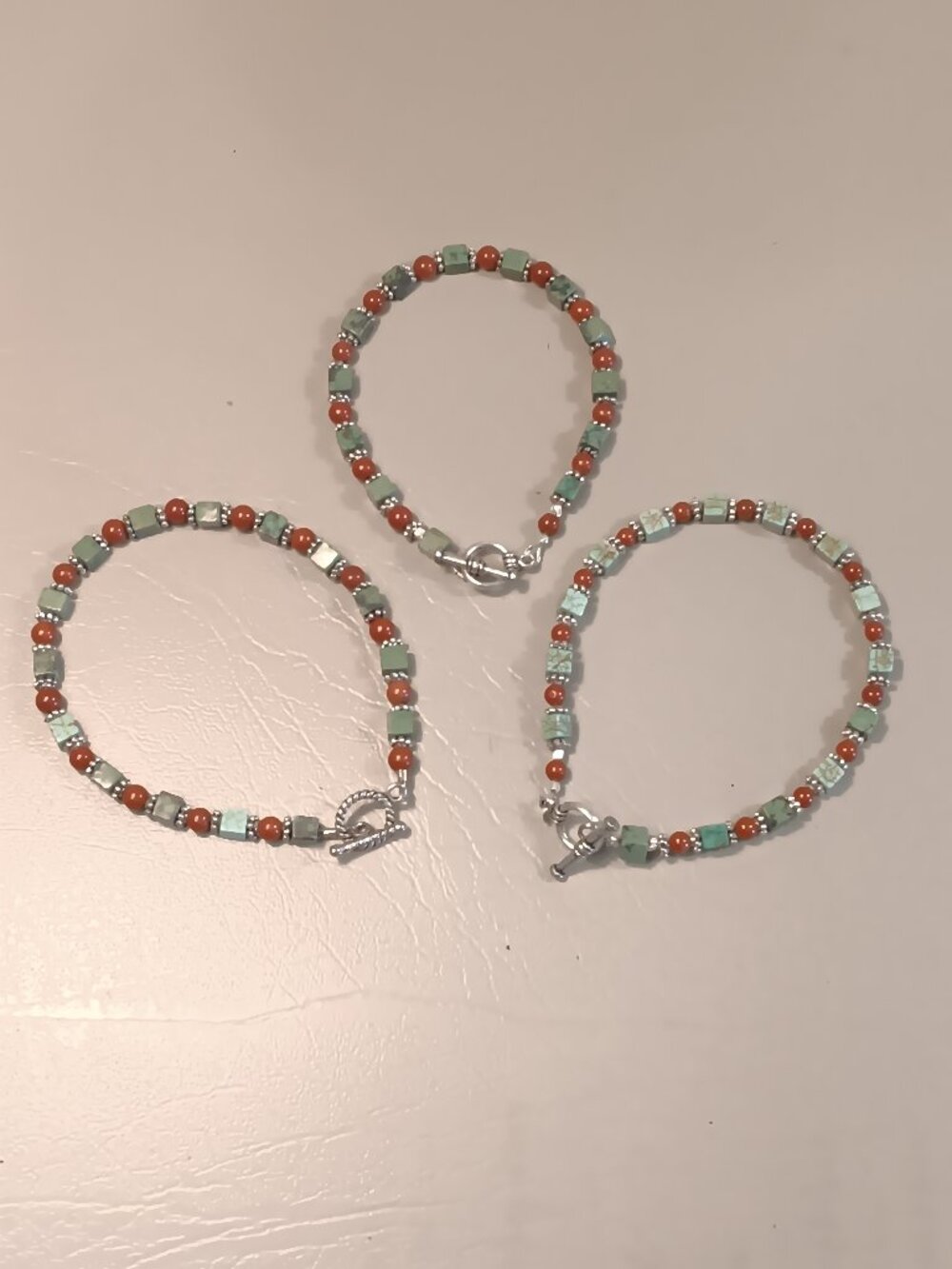 Lot of 3 stone bead bracelets green brown silver tones